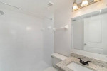 Renovated bathroom in a two-bedroom unit at Park at Murano, featuring modern fixtures and granite countertops.