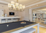 Luxurious club room with billiard table and modern decor at apartment community in Coral Gables, FL