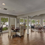 Cozy resident clubhouse with courtyard views and ample seating in Pinellas Park, Florida.