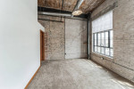 Spacious urban loft with exposed brick walls and large windows in Appleton, WI