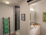 Modern bathroom interior at AVA DoBro apartments with stylish fixtures and decor