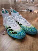 Adidas football boots for playing on artificial turf