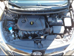 Kia Forte engine bay with low mileage features like Bluetooth, USB connectors, and good condition.