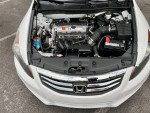 Engine view of a 2012 Honda Accord LX-P with 93,000 miles, showcasing its features and condition.
