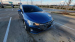 2019 Hyundai Elantra SEL in blue parked with clear skies in the background, featuring a modern design.