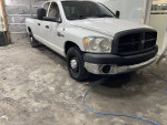 2007 Dodge Ram 2500HD 4-door pickup truck with 146,000 miles, ready for work, featuring new tires and upgraded suspension.