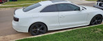 2009 Audi A5 S-Line in white with black wheels parked on the street, showcasing its sleek design.