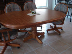 Oak Oval Pedestal Dining room Table with 2 leaves.