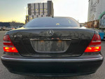 Rear view of a 2002 Mercedes-Benz S430, showcasing luxury design and sleek tail lights.