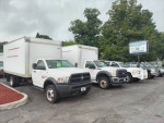 Lineup of used box trucks for sale at Marcoccias Auto Sales, including Dodge and Ford models.