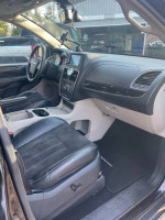 Interior view of a well-maintained 2014 Chrysler Town & Country minivan with entertainment features