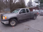 2012 GMC Sierra 4x4 Xtra cab in gray with 58,600 miles parked on a residential street