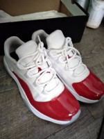 Red and white Jordan low top 11s Mens size 9/1/2