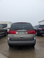 Rear view of a 2007 Buick Rendezvous CXL in a parking lot, showcasing its design and structure.