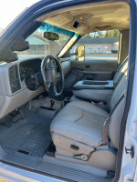 Interior view of a 2003 Chevrolet Silverado 1500 showing leather seats and dashboard features