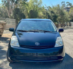 Front view of a black 2005 Toyota Prius hatchback with 96,115 miles, highlighting its hybrid design.