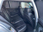 Interior view of a used 2002 BMW 5 Series 525i with black leather seats