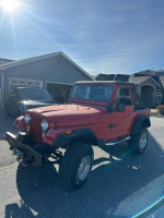 1976 Jeep CJ7 off-road vehicle in excellent condition with red paint and 96,000 miles, ready for adventures.
