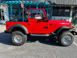 1976 Jeep CJ7 in red, featuring off-road capabilities, 4WD, and a clean title for sale.