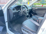 Interior of a 2018 Volkswagen Tiguan S, featuring black seats and dashboard, in excellent condition.
