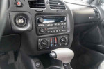 Interior controls and audio system of a 2001 Chevrolet Monte Carlo LS with low mileage.
