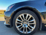 Close-up of the alloy wheel of a 2013 Lexus LS 460 L showcasing its sleek design.