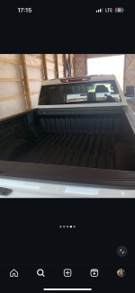 Interior view of the bed of a 2020 Chevrolet Silverado 2500HD Custom pickup truck.