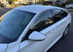 2018 Honda Civic EX-L sedan in pristine condition with low mileage of 34,000, showcasing a clean exterior and windows.
