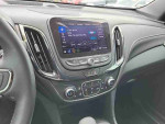 Interior view of a 2022 Chevrolet Equinox LT with touchscreen display and audio controls.