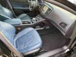 Interior of 2016 Chrysler 200S featuring blue leather seats, navigation system, and modern design.