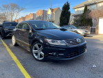 2013 Volkswagen CC R-Line FWD sedan in black, fully loaded with navigation and leather interior, parked on city street.
