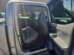Interior view of 2016 Toyota Tacoma Double Cab with spacious seating and clean layout for sale in North Las Vegas.