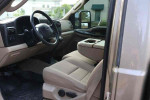Interior view of a 2005 Ford F-250 Super Duty XLT truck showing seats and dashboard.
