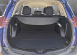 Interior view of the spacious trunk of a 2014 Toyota RAV4 LE in good condition.