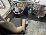 Interior view of a 1990 Volvo 760 GLE cab, showcasing dashboard and seats in good condition.