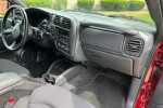 Interior view of a 2003 Chevrolet S-10 LS ZR2 with clean dashboard and seats, showcasing low mileage of 7,400.