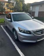 2012 Honda Accord EX-L V-6 parked with 150,000 miles, featured in silver color.
