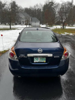 2010 Nissan Altima 2.5 SL sedan rear view, well-maintained with new battery and recent tires.