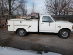 1996 Ford F350 service truck with low miles and strong V8 engine parked on a street