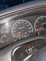 Dashboard of 1997 Ford F-150 Lariat showing 203,522 miles and various gauges.