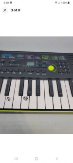 CASIO SA-46 Mini Keyboard Black & Green 32 Keys 100 Tones 50 Patterns