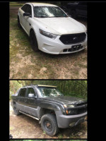 2013 Ford police interceptor sedan in white with a Chevy Avalanche 1500 Z71 4wd, both needing repairs.