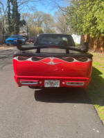Rear view of a custom 1995 Chevrolet S-10 with unique paint and sporty styling.
