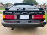 1985 Toyota Supra rear view, beautifully restored with new paint and interior, perfect for car enthusiasts.
