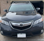 Front view of a 2014 Acura RDX with Graphite Luster Metallic exterior and leather interior.