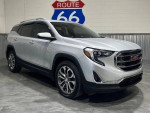 2018 GMC Terrain SLT FWD in showroom with Route 66 sign, 63,618 miles and automatic transmission.
