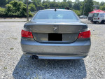 Rear view of a 2004 BMW 530i in excellent condition with gray exterior and dual exhaust.