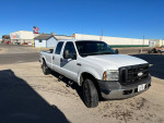 2006 Ford F-250 with custom bumper and toolbox, well-maintained, parked outside in daylight.