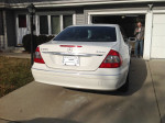 2007 Mercedes-Benz E350 4-Matic sedan parked in driveway, white color with saddle interior and 141,000 miles.