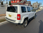 2014 Jeep Patriot SUV with 126,000 miles, well-maintained, 4WD, automatic transmission, spacious interior.